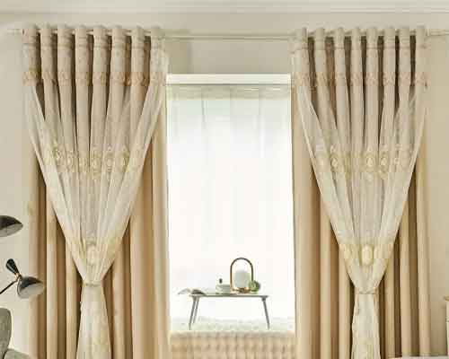 Contemporary window treatment display in a bright, airy room.