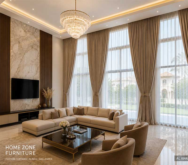 A wide shot of a luxury Al Khawaneej villa living room featuring floor-to-ceiling custom drapes from Home Zone Furniture.